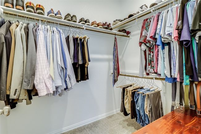 Spacious closet featuring carpet | Image 24