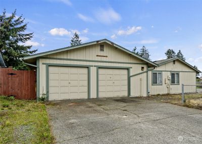 Detached garage / shop provides covered parking or space for tinkering | Image 3