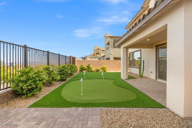View of yard with a fenced backyard and a patio area | Image 50