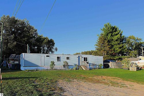6064 Us Highway 31, Grawn, MI, 49637-9676 | Card Image