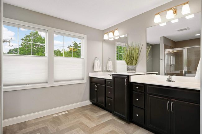 Primary bathroom with ample cabinetry. | Image 28