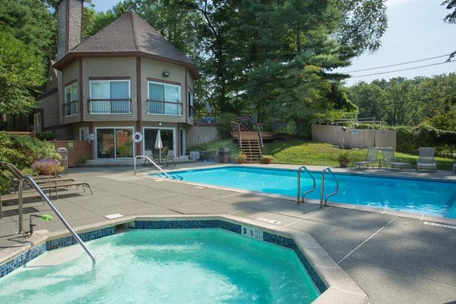 Pool with a community hot tub, a patio area, and fence | Image 20