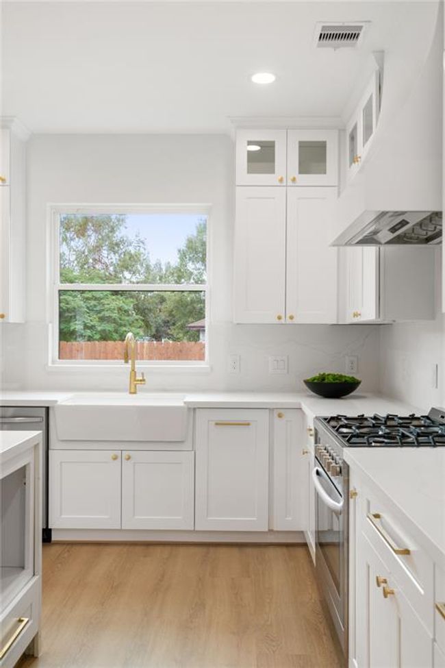 Farmhouse sink overlooking the back yard | Image 11