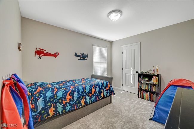 Bedroom with carpet flooring and baseboards | Image 43