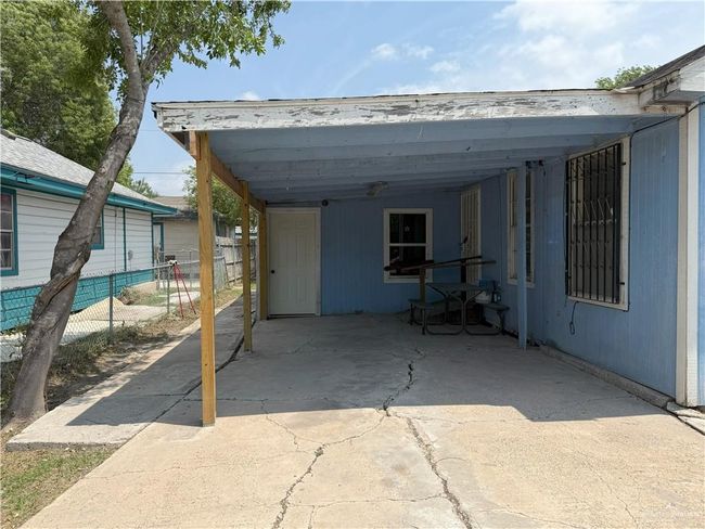View of patio with fence and an attached carport | Image 29