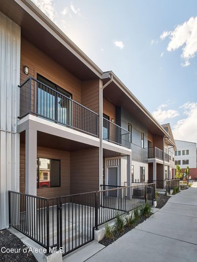 Front elevation with fenced front porch, looking toward Kindred & Co and Shift Fitness | Image 3