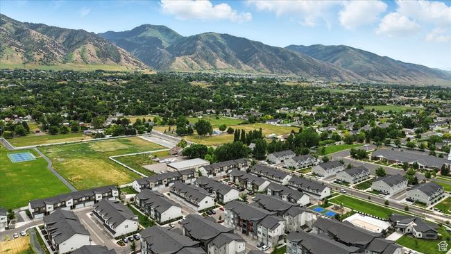 Aerial overview of property's location with nearby suburban area and a mountain backdrop | Image 29