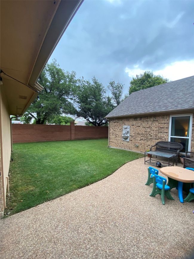 View of yard featuring fence and a patio | Image 31