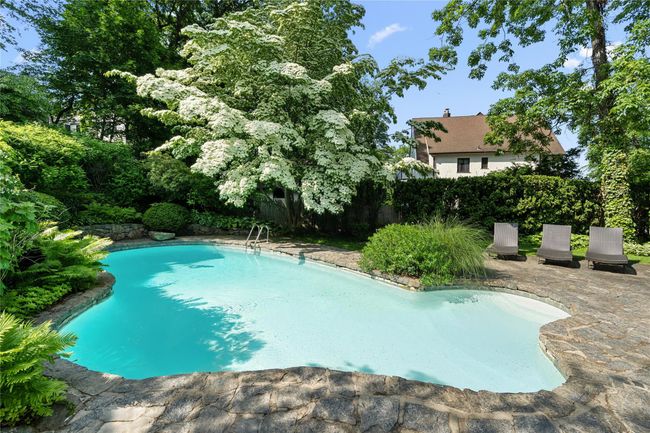 View of pool with a patio | Image 36