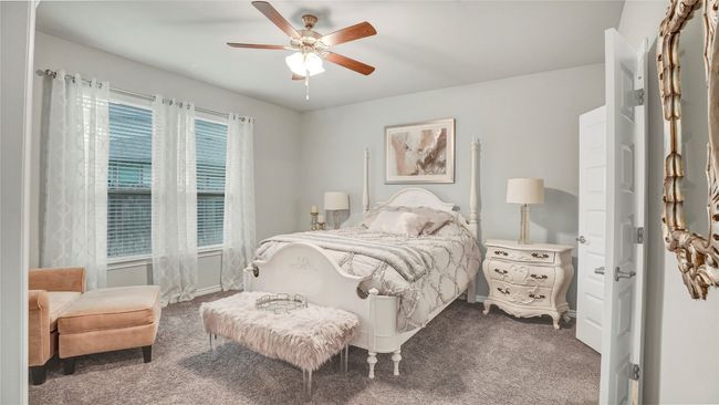 Bedroom featuring a ceiling fan and carpet flooring | Image 16