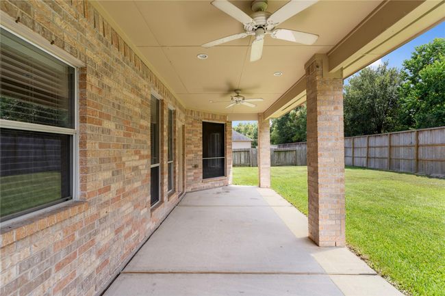 Covered patio with fan installation | Image 30
