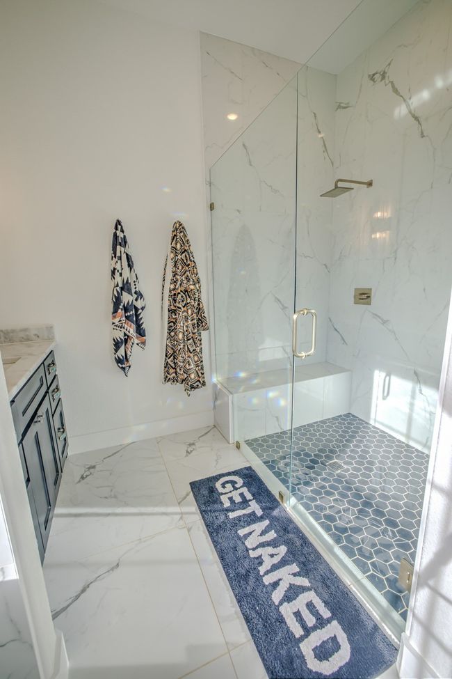 Full bathroom with vanity, baseboards, marble finish floor, and a marble finish shower | Image 16