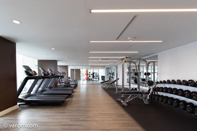 Exercise room with wood finished floors, plenty of natural light, and recessed lighting | Image 16