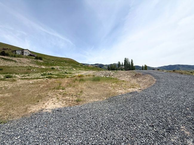 View of street featuring a mountain view | Image 6