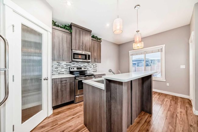 23 Baysprings Way Sw, Home with 3 bedrooms, 3 bathrooms and 1 parking in Airdrie AB | Image 14