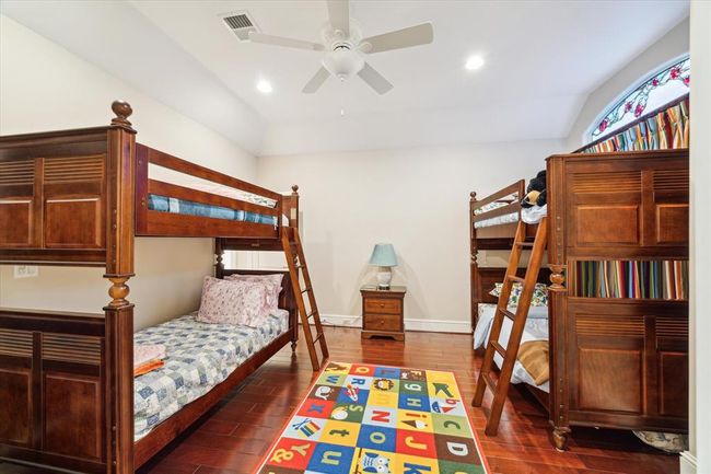 This cozy bedroom large enough for two bunk beds. | Image 24