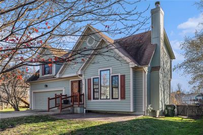 View of front of property with a garage and a front yard | Image 2