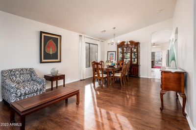 First, let's take a view of the main living areas of the home, starting with the front living and dining areas. Notice the natural light coming in from the window. | Image 2