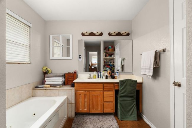Master suite has a bathroom featuring a jetted tub, and stand-alone shower(not pictured) | Image 12