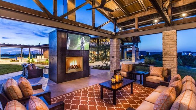 View of patio / terrace featuring an outdoor living space with a fireplace | Image 23