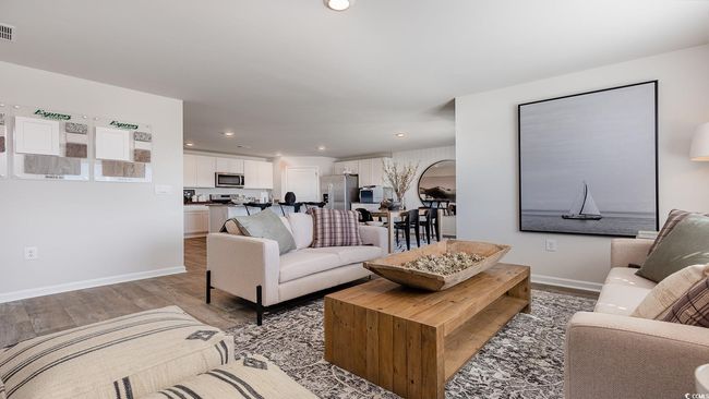 Living room with recessed lighting, baseboards, visible vents, and light wood-type flooring | Image 11