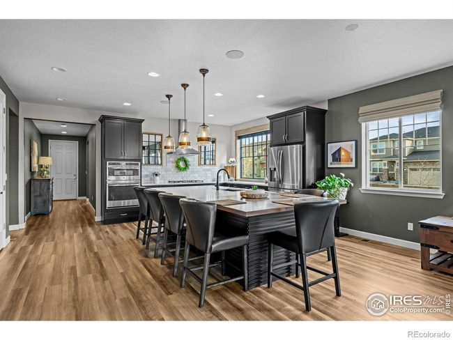 Upgraded fixtures as seen in the open concept kitchen | Image 11