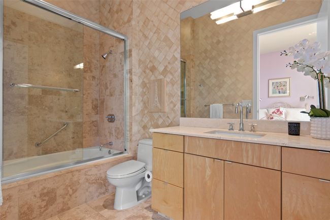 Spa-like bathroom with luxurious soaking tub and a glass-enclosed shower | Image 27