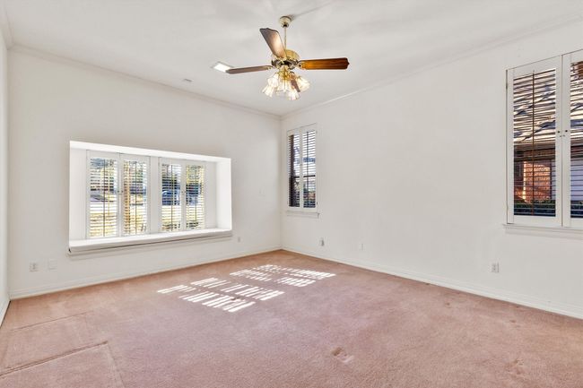 Fourth bedroom with cozy window seat, lots of windows for so much natural light. | Image 37
