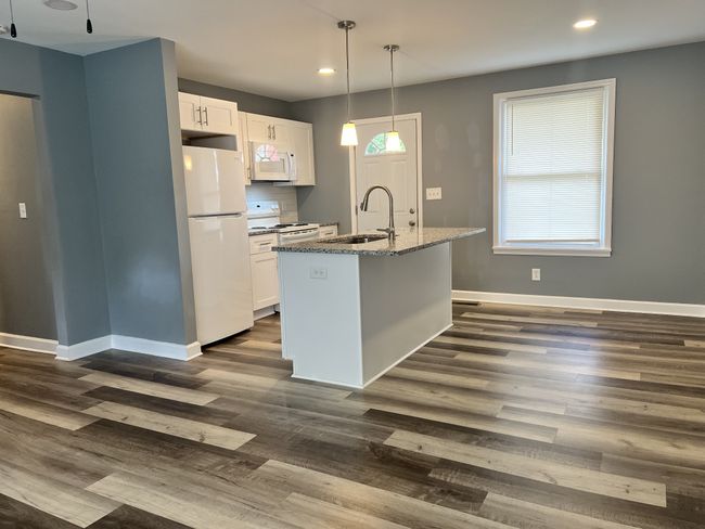 New lighting and laminate floors for easy maintenance and style. | Image 5