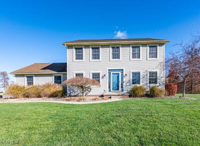 Colonial house with a front yard | Image 1