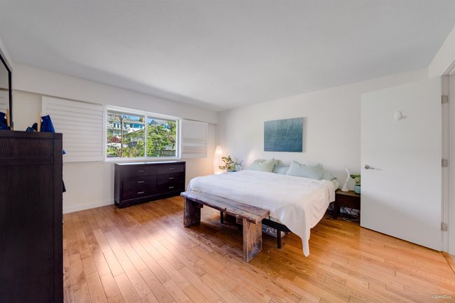Bedroom with baseboards and light wood-type flooring | Image 23