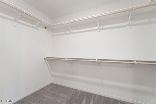 Spacious closet with carpet floors | Image 23