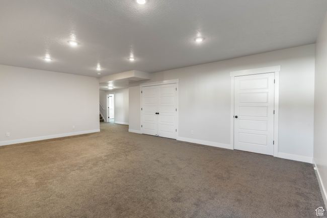 Living room featuring storage closet and utility room (Double doors). | Image 44