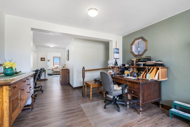 Note the ramp incline going to the right to the main floor primary bedroom suite | Image 9