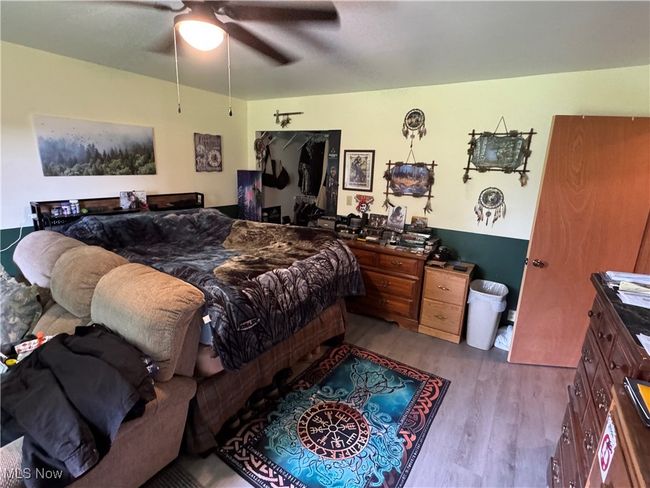 Bedroom featuring wood finished floors and a ceiling fan | Image 15
