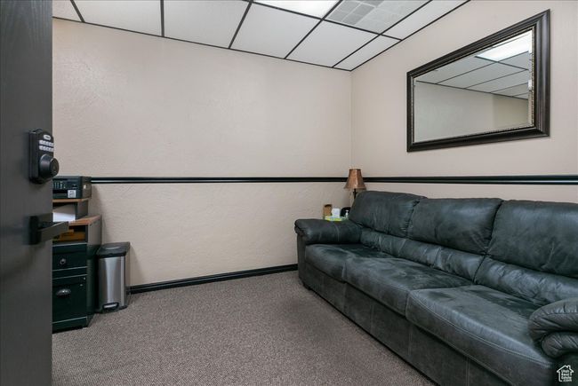 Living room featuring carpet flooring and baseboards | Image 7