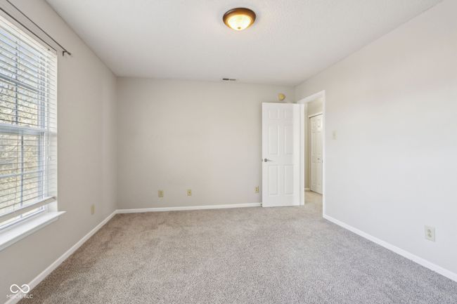 carpeted empty room with plenty of natural light and baseboards | Image 56