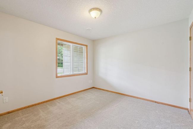 Lower level bedroom, new carpet, new paint, could be an office or flex room | Image 23