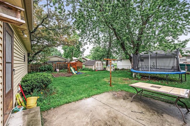 Large back yard! Fully fenced. 10x12 storage shed. | Image 17