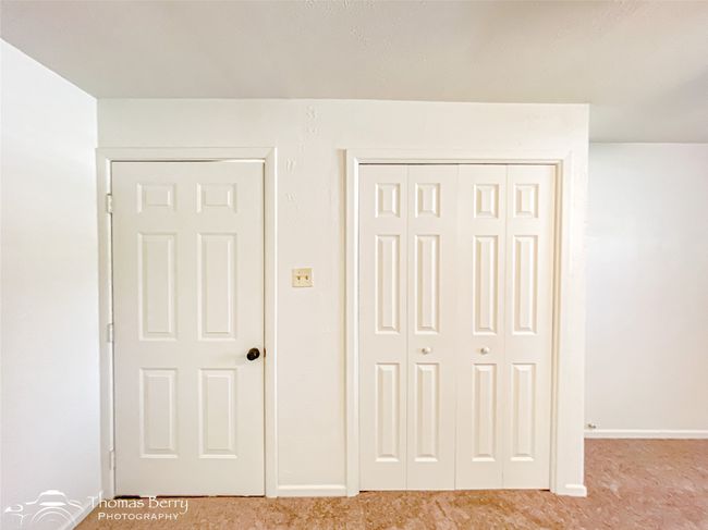 Unfurnished bedroom featuring light colored carpet and a closet | Image 7