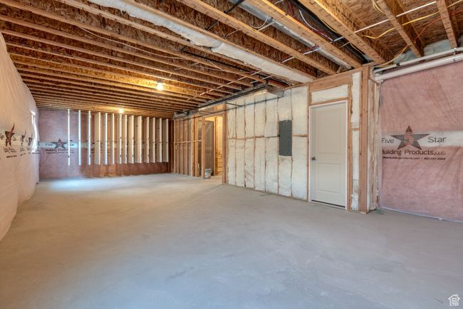 Unfinished below grade area featuring electric panel | Image 14
