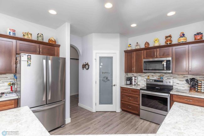 Doorway to garage and main floor laundry | Image 19