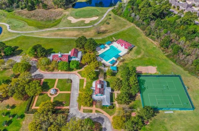 picture of ONE of the two community center areas in Windrose. Here you can see our Meeting House, Club House, courtyard area, 1 of 2 of the pools in the community, &tennis courts. PLUS there is a large green space for soccer | Image 47