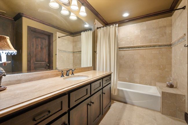 En-suite bathroom with walk-in closet connected to guest bedroom | Image 33