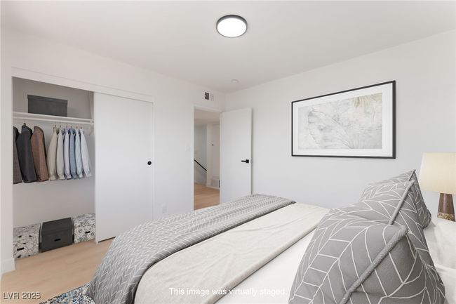 Bedroom featuring a closet and wood finished floors | Image 42
