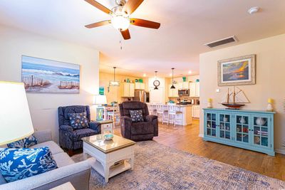 Living room with ceiling fan and light hardwood / wood-style flooring | Image 3