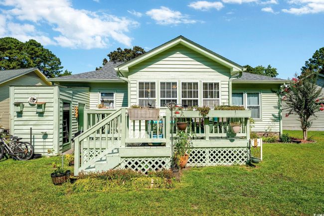 View of side of property with a yard and a deck | Image 19