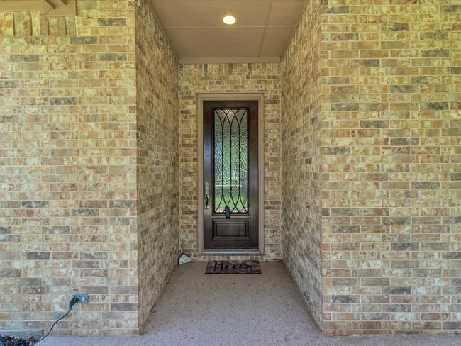 Entrance to property with brick siding | Image 4