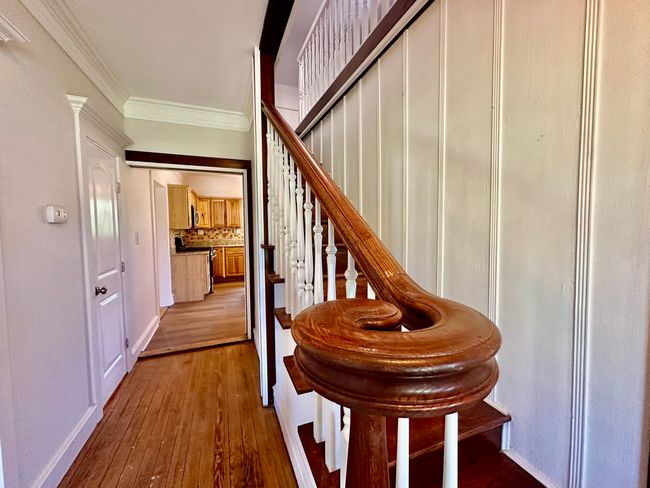 Stairway featuring crown molding and hardwood / wood-style floors | Image 14