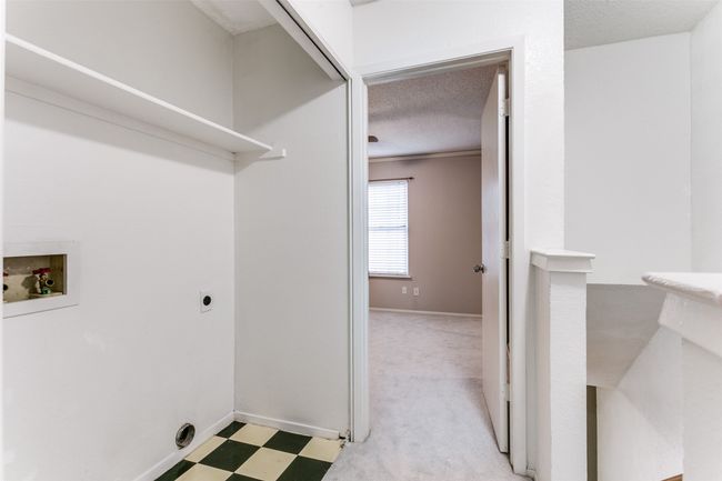 Washroom featuring hookup for a washing machine, hookup for an electric dryer, a textured ceiling, and light flooring | Image 22